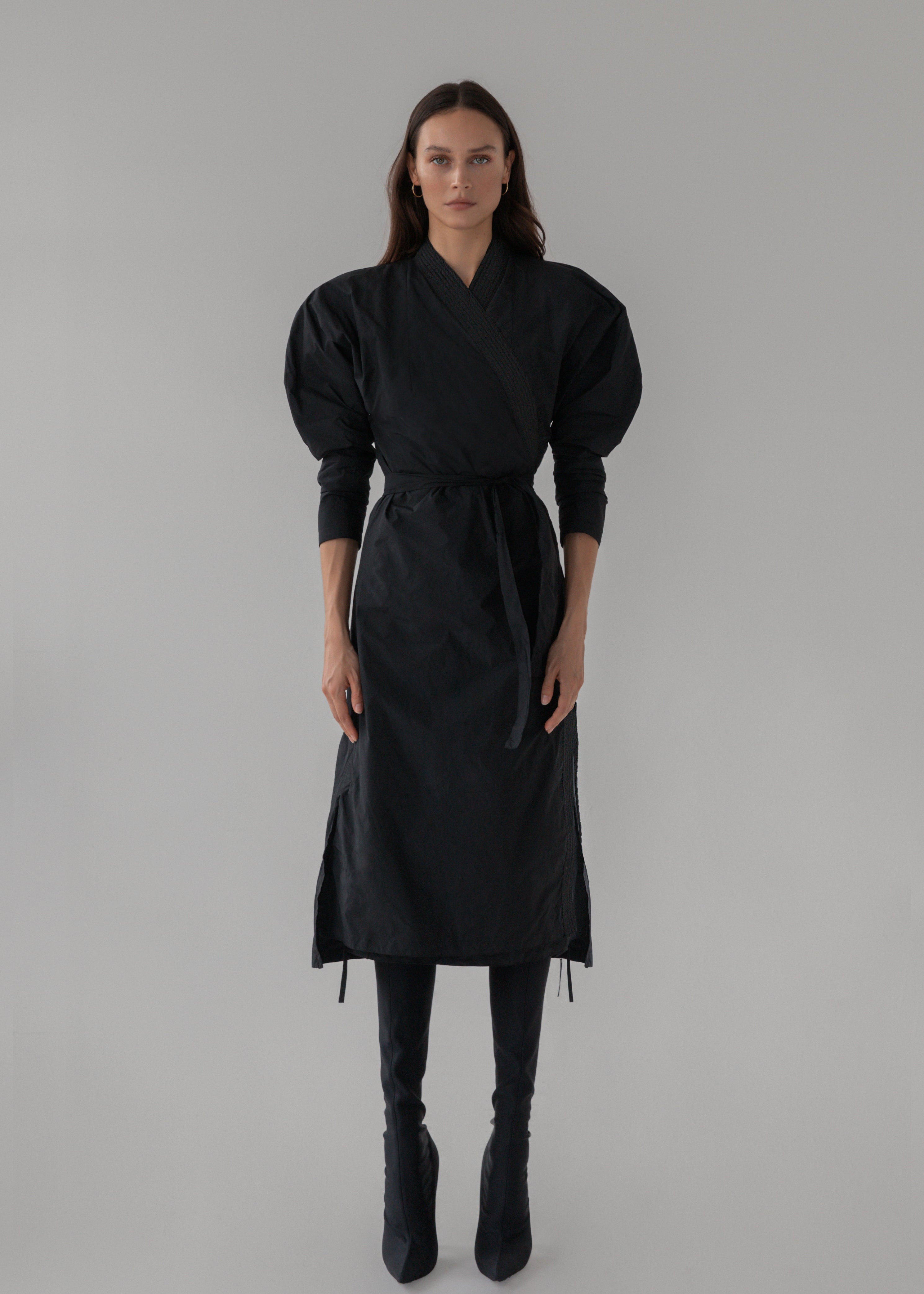 Model wears black wrap kimono style dress