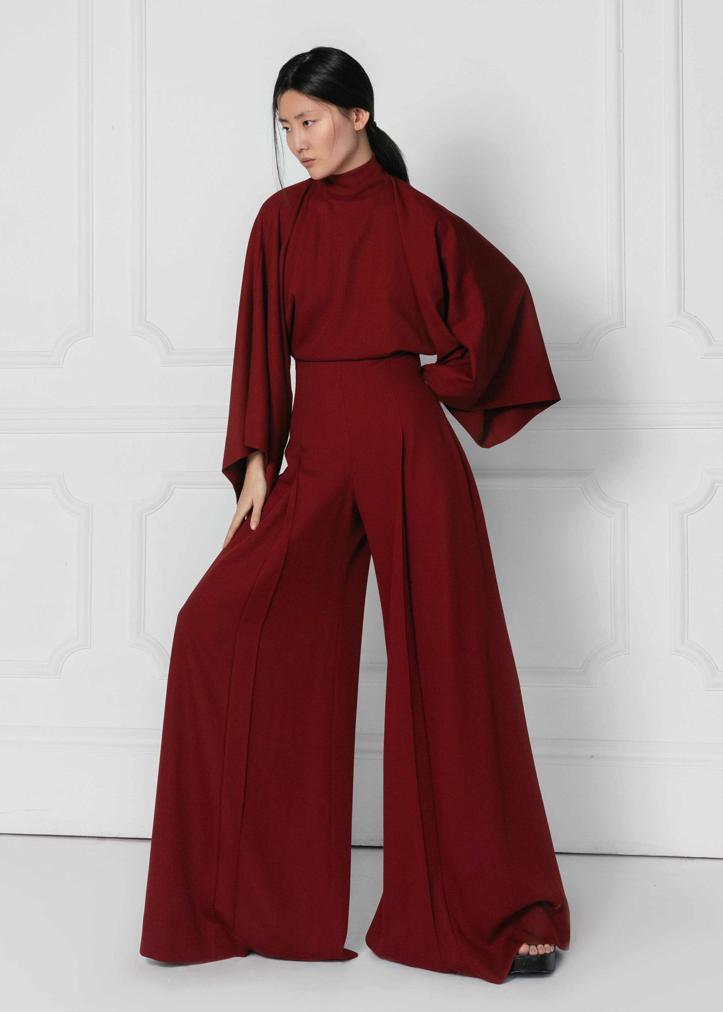 Model wears Red wide leg statement jumpsuit